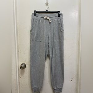 lightly worn grey joggers
